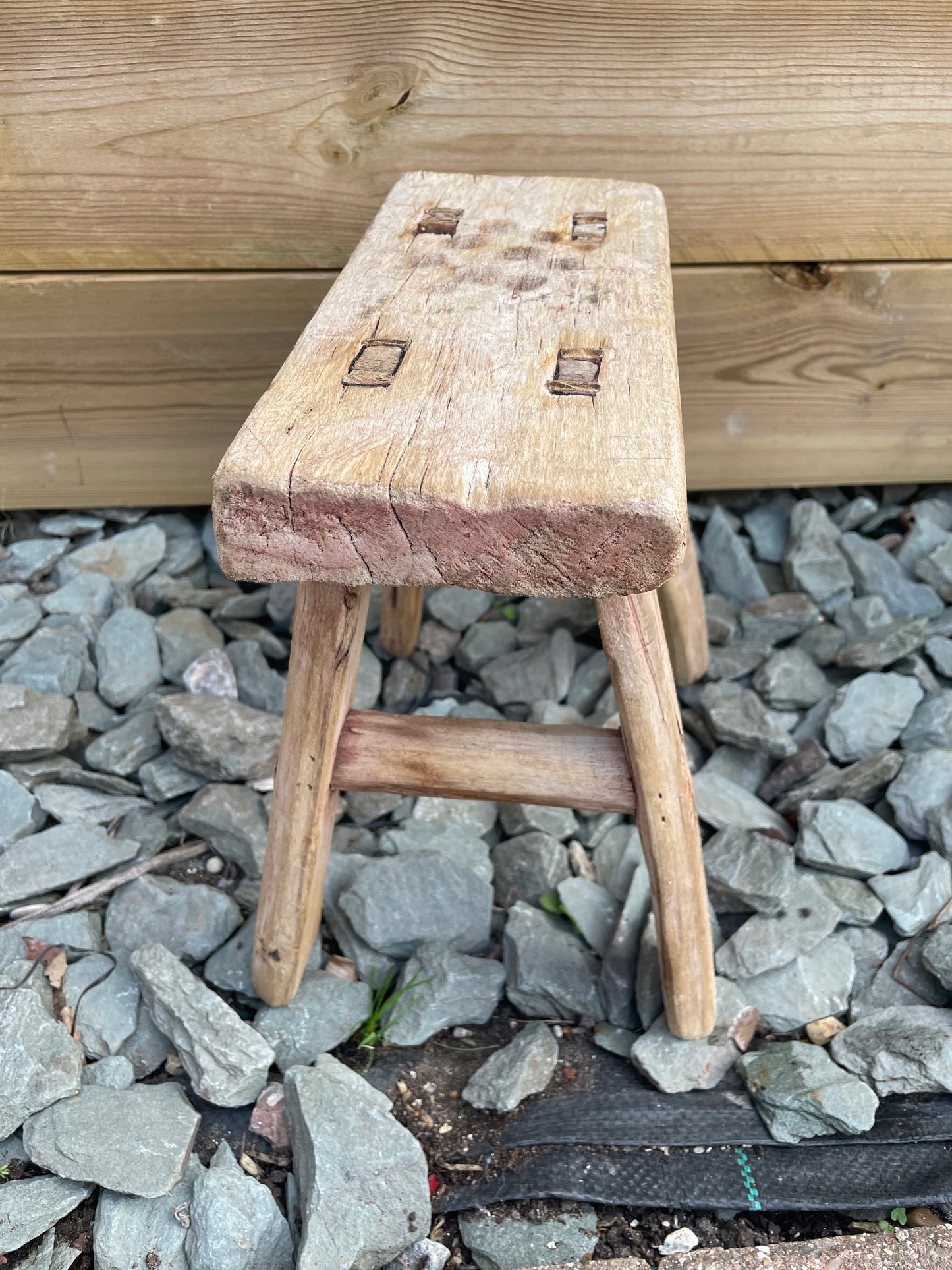 Mini rustic wooden bench stool pot stand table.