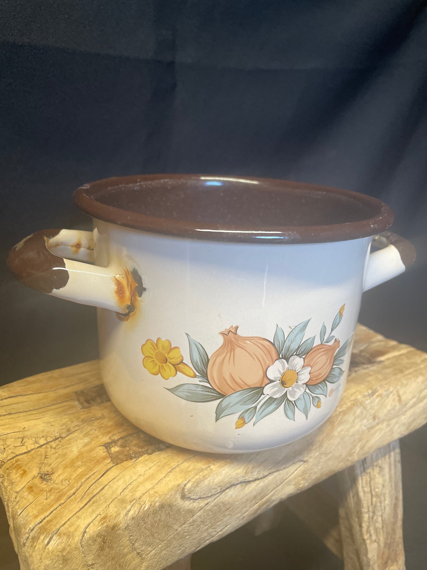 Enamel small two handled cooking pot cream and brown with floral design.