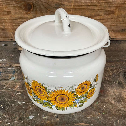 White enamel pot with handle and lid, sunflower décor.