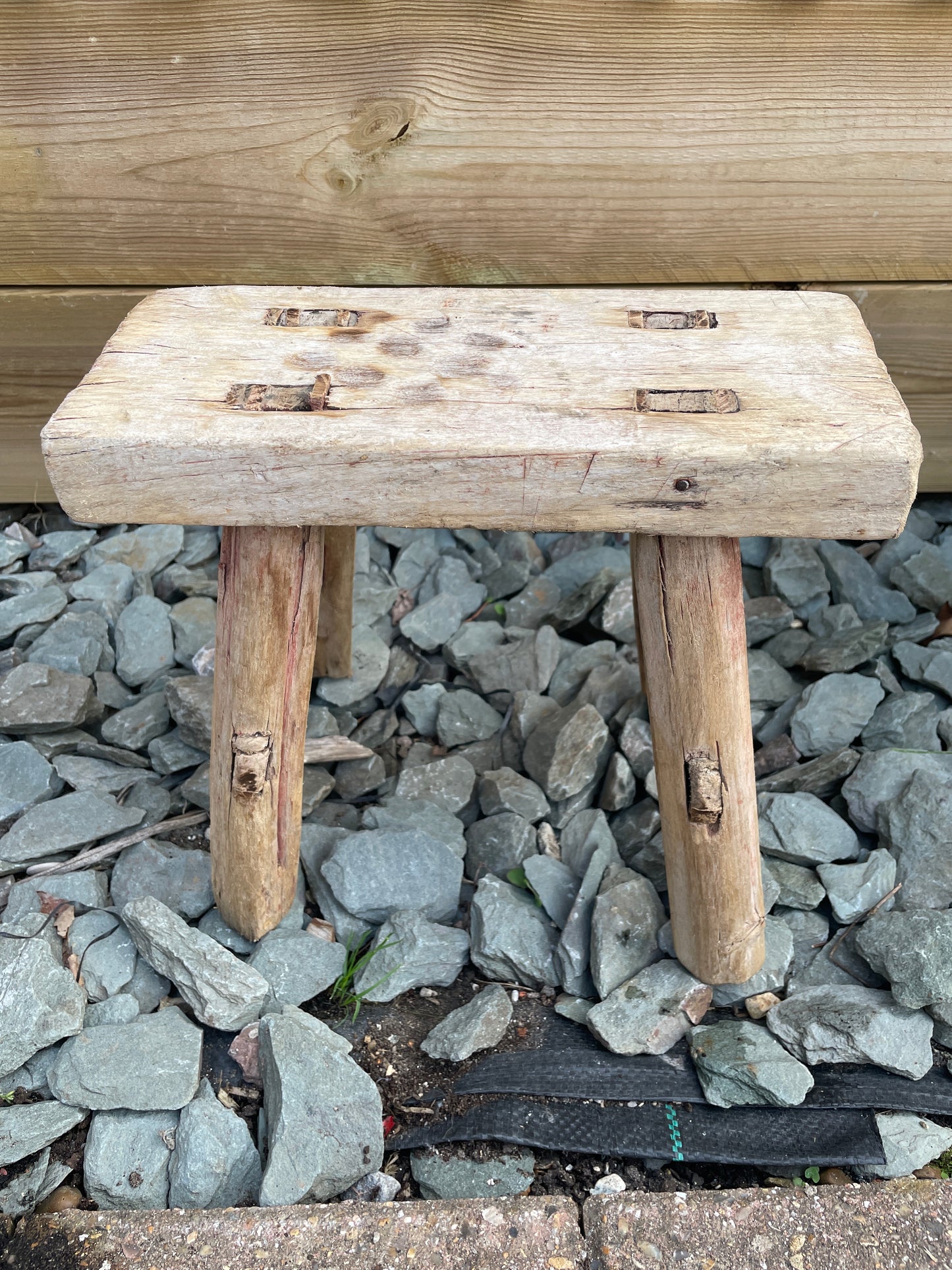 Mini rustic wooden bench stool pot stand table.