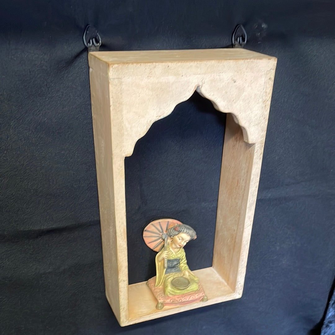 Single Indian wooden temple arch shelf light beige distressed finish.