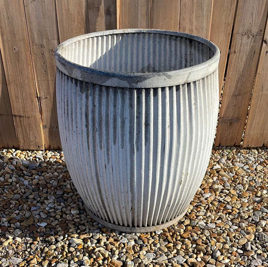 Vintage zinc dolly tub with fluted sides.