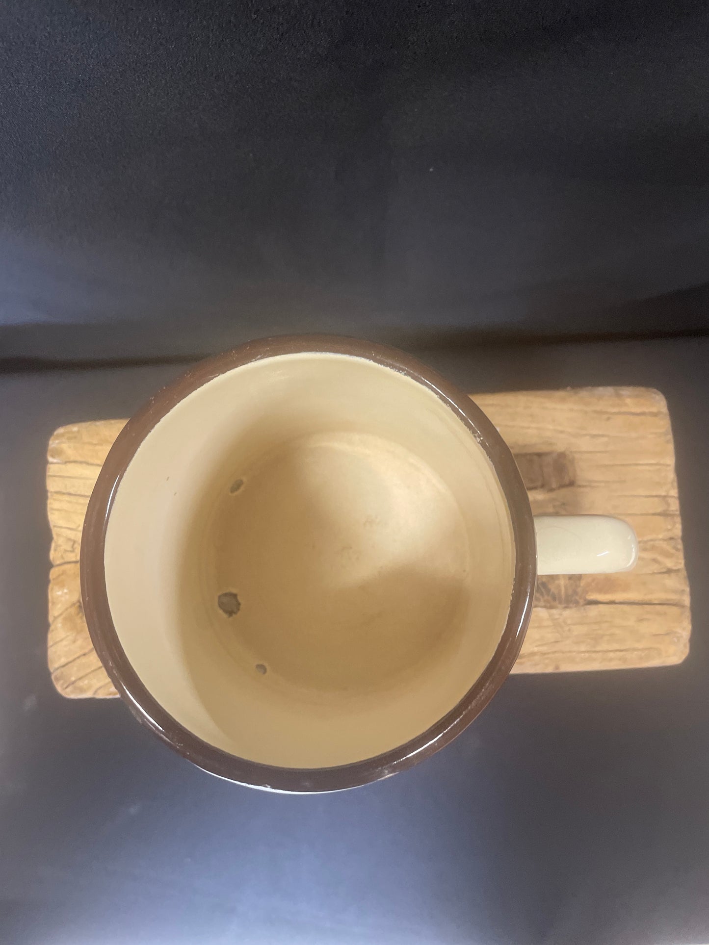 Large cream enamel mug with sunflowers decor.