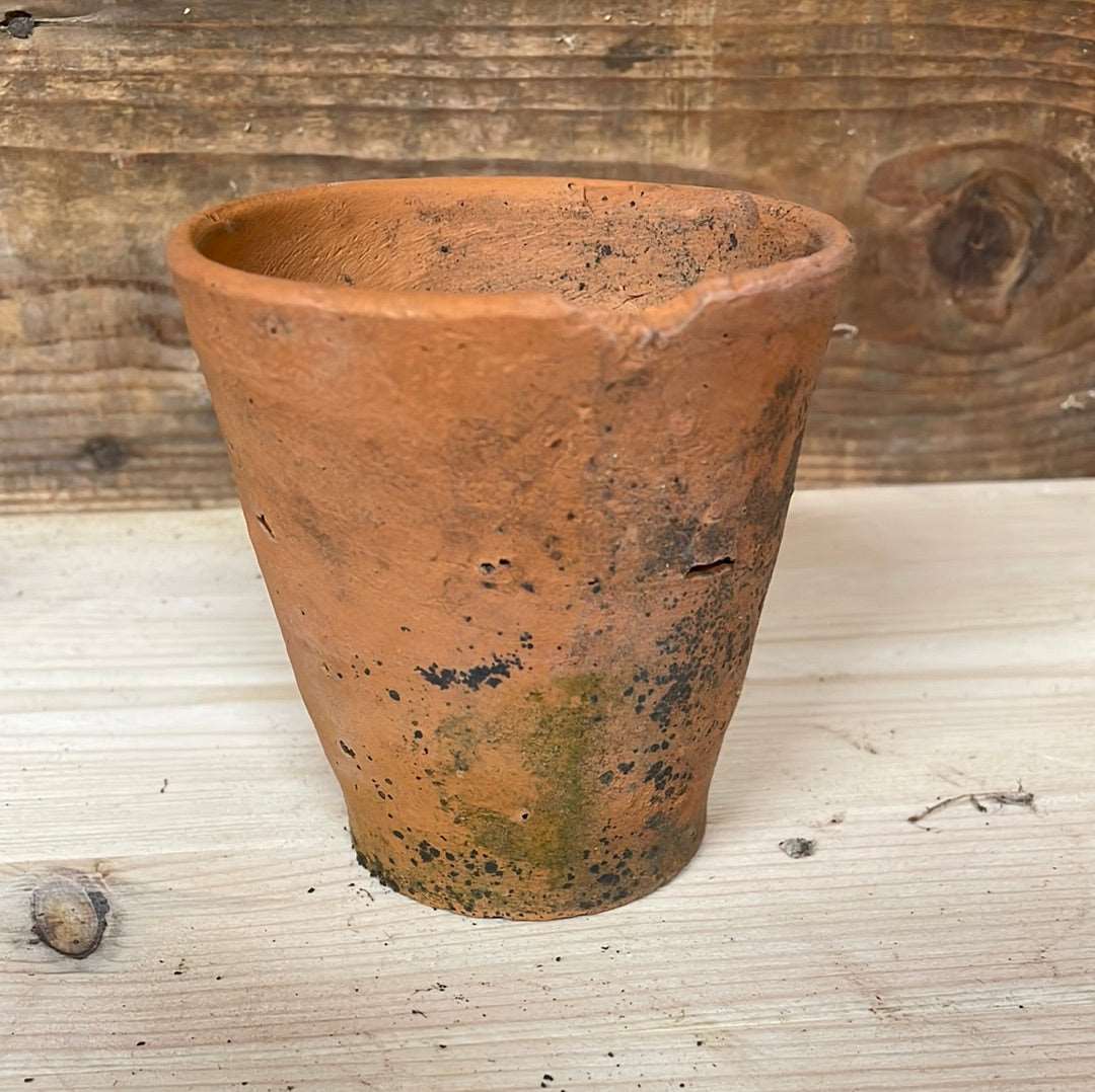 Vintage small terracotta plant flower seedling pot.
