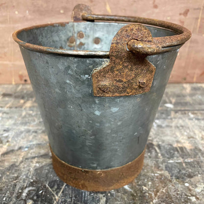 Mini metal rustic bucket with metal handle.