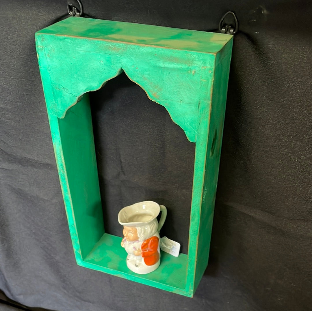 Single Indian wooden temple arch shelf green distressed finish.