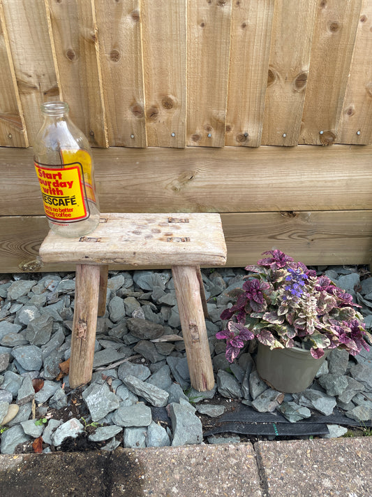 Mini rustic wooden bench stool pot stand table.