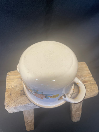 Enamel small two handled cooking pot cream and brown with floral design.