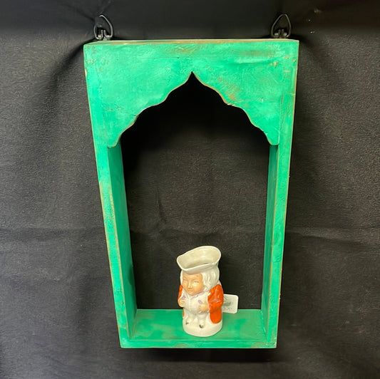 Single Indian wooden temple arch shelf green distressed finish.