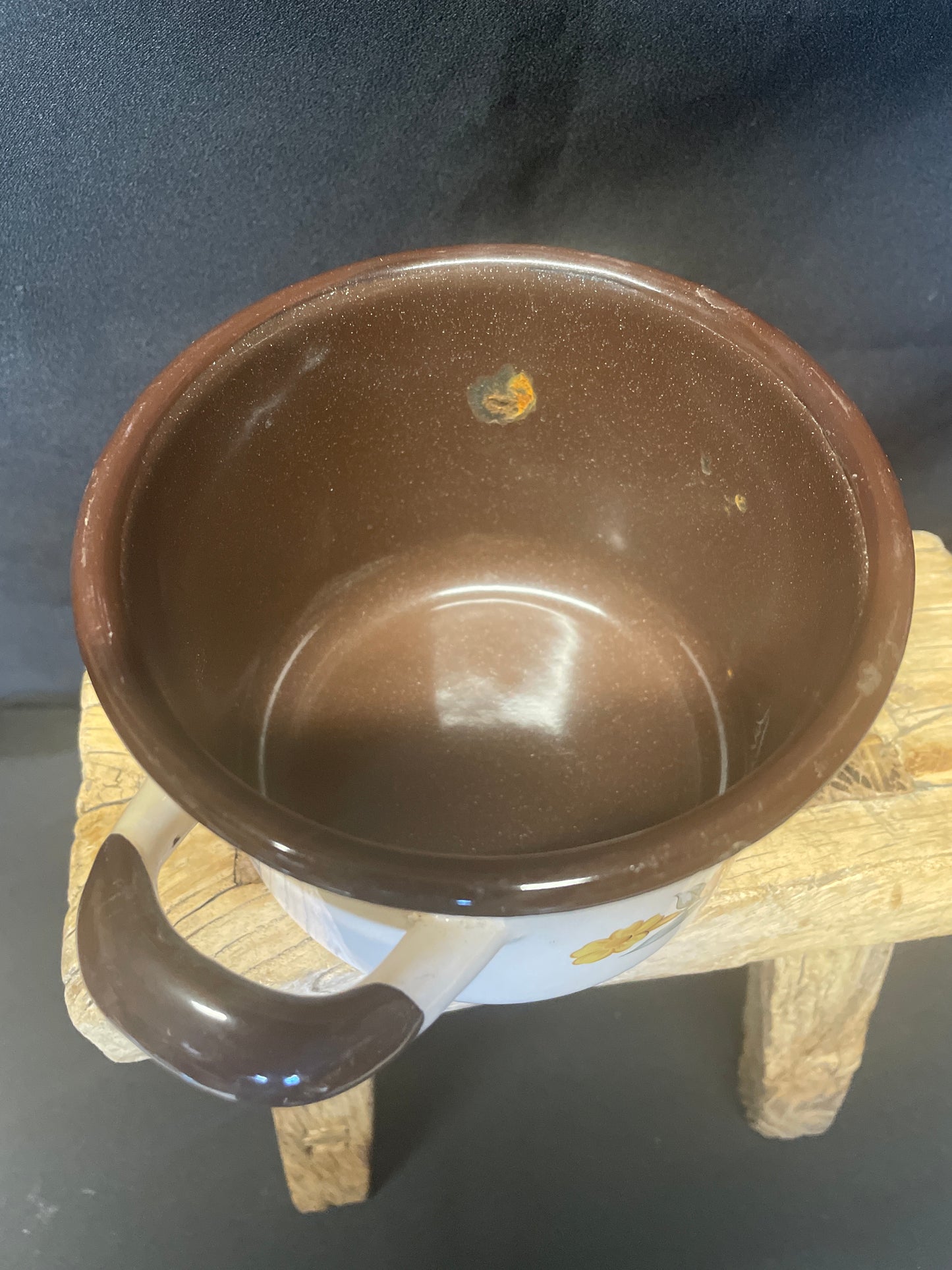 Enamel small two handled cooking pot cream and brown with floral design.