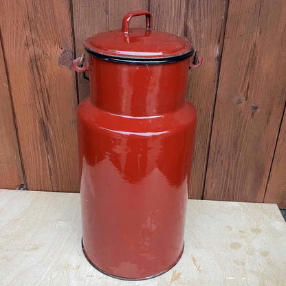 Brown enamelled churn container with lid.