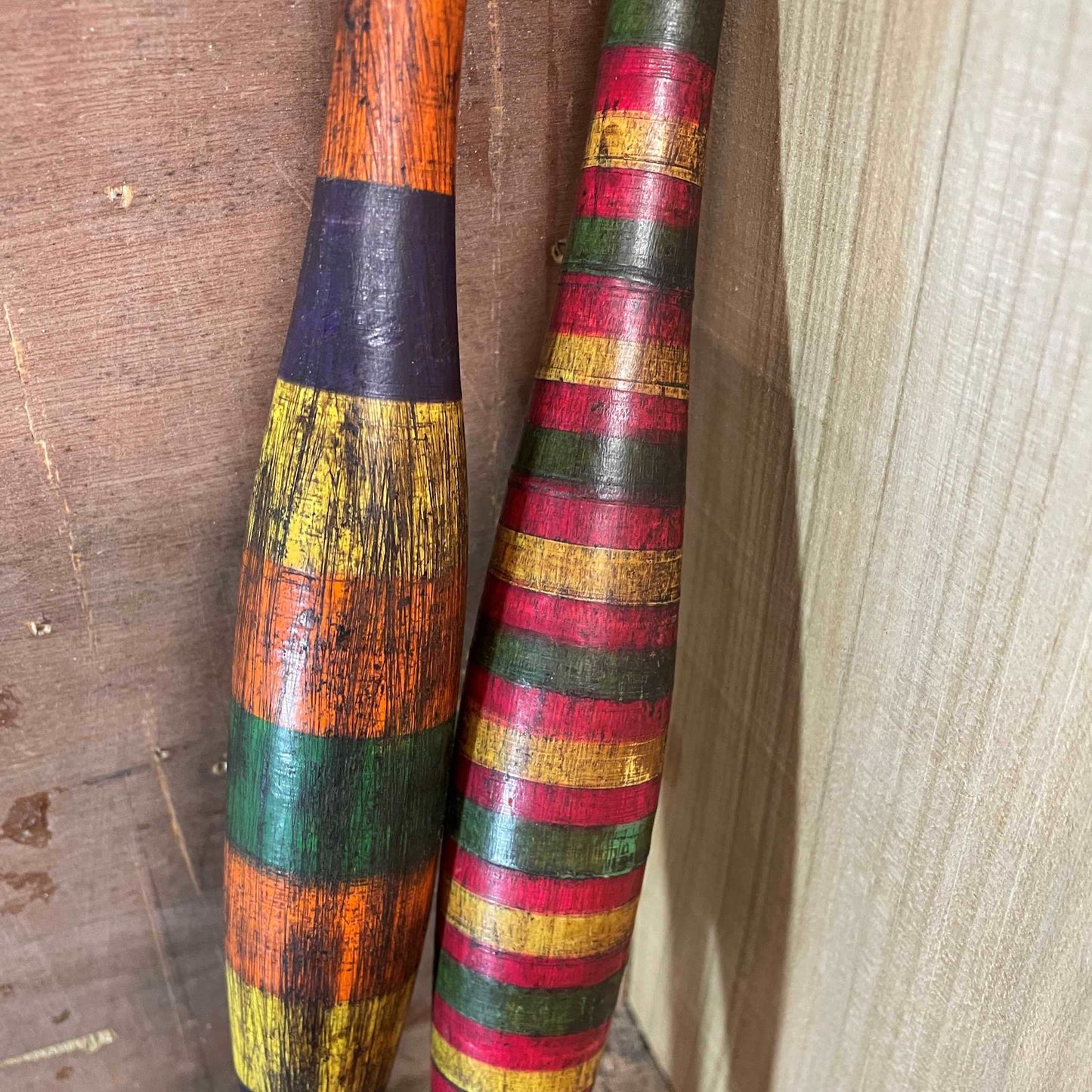 Close up of Indian wooden painted rolling pin.