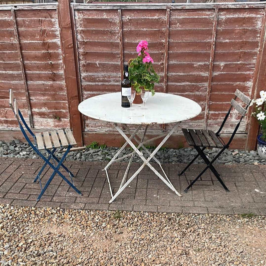 Vintage French round folding bistro table.