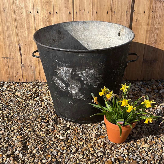 Taper sided two handled rustic galvanised bin planter worn black paint.