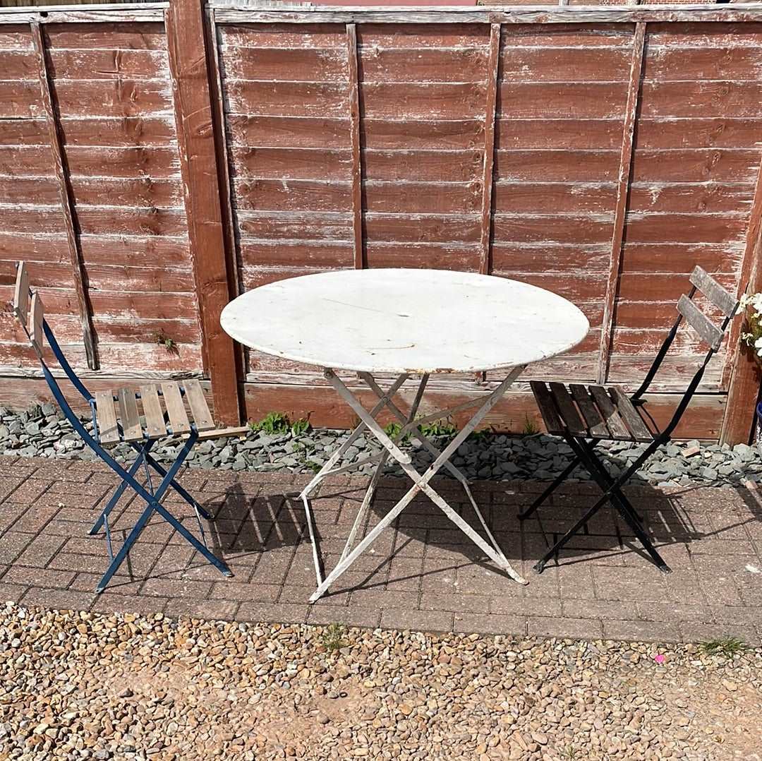 Vintage French round folding bistro table.