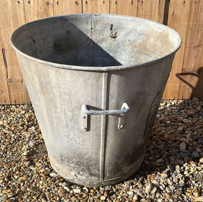 Taper sided two handled rustic galvanised bin planter.