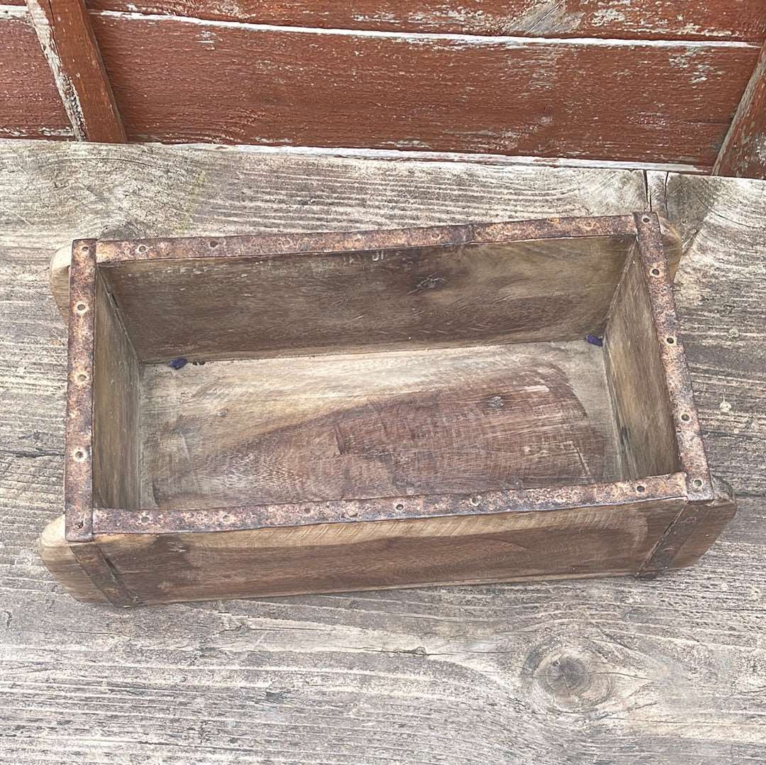Top view of single Indian rustic wooden brick mould, top view..