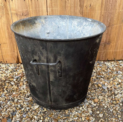 Tapered sided rustic galvanised two handled bin garden planter aged black paint.