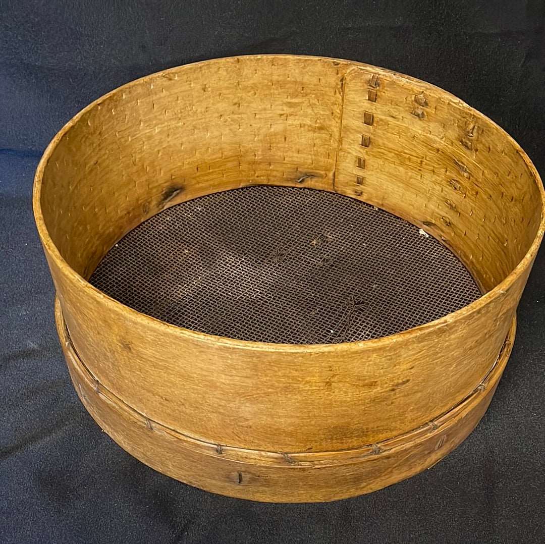 Vintage wooden sided grain sieve.