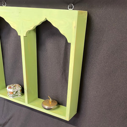 Wooden Indian temple style double sided shelf, light green.