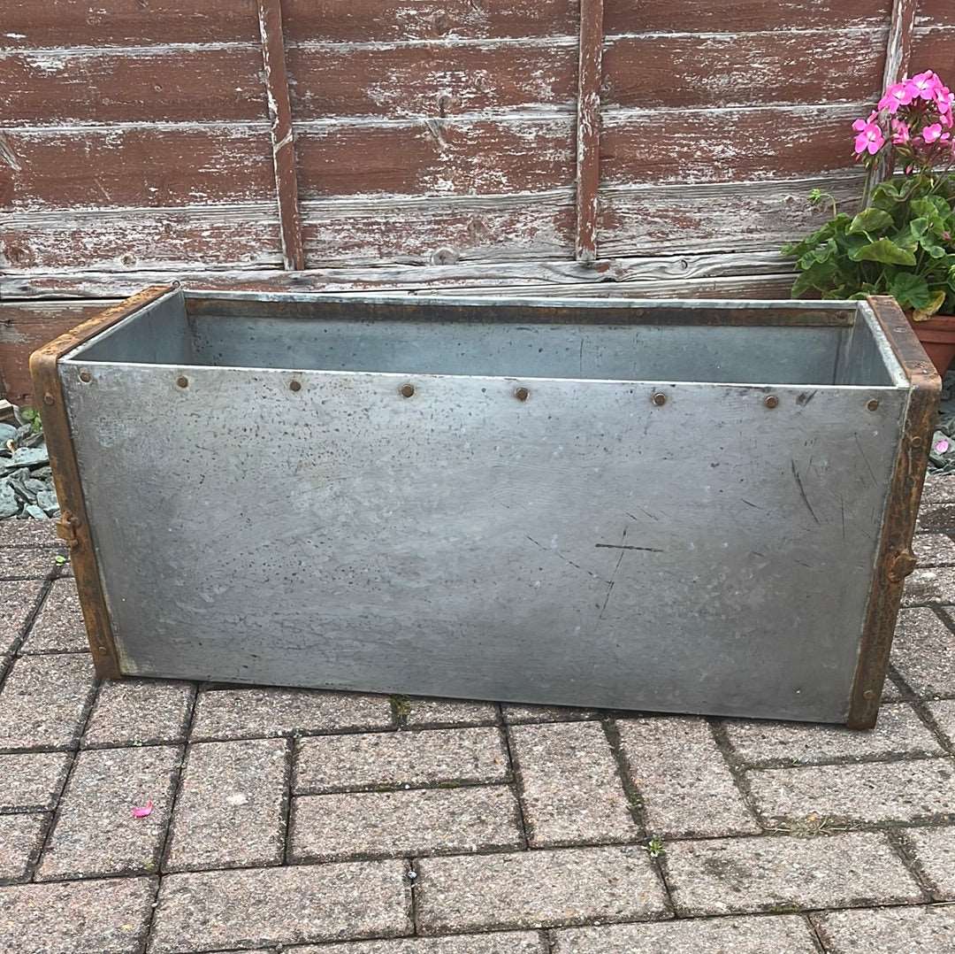 Rectangular metal trough planter.