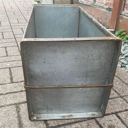 Rectangular metal trough planter. End view.