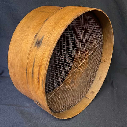Vintage bent wood grain sieve.