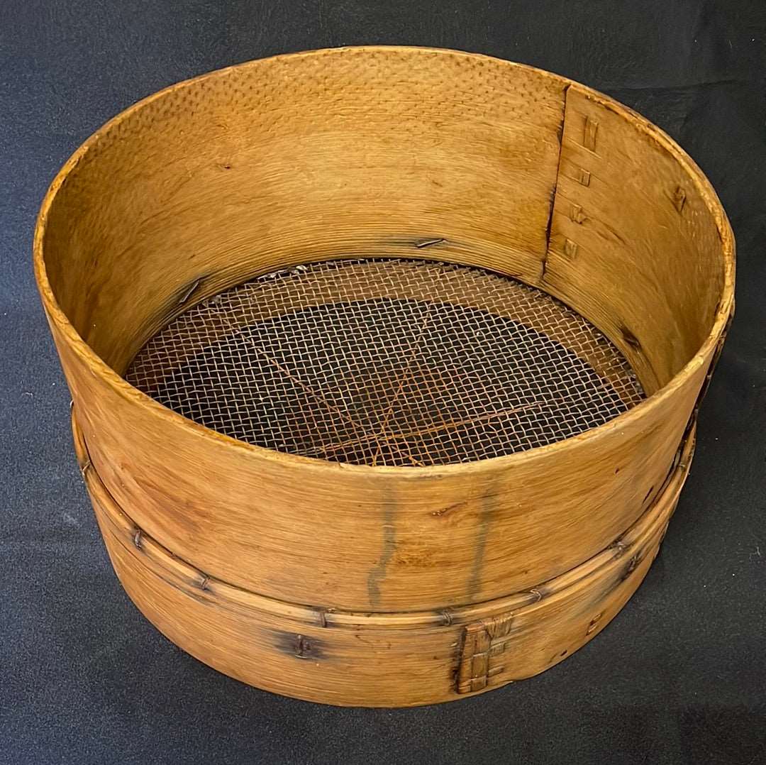 Vintage bent wood grain sieve.