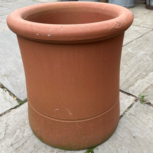 Small terracotta chimney pot.